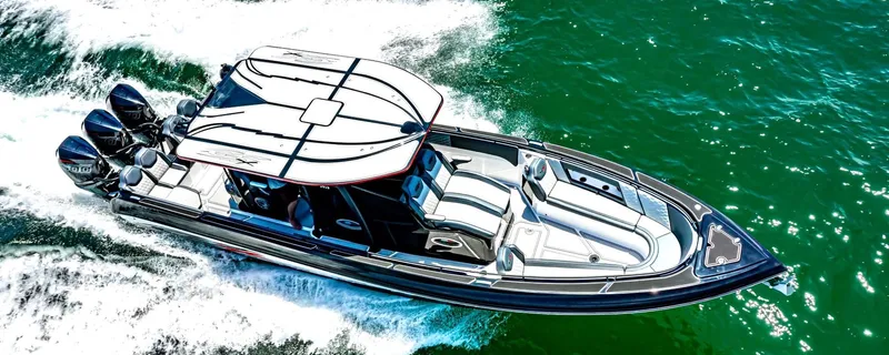 Slide: The Image of 2025 Glasstream GSX 360 LS speedboat cruising on vibrant green water. - 9