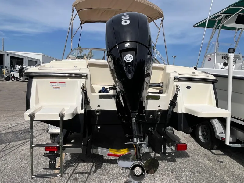 Slide: The Image of 2021 Scout 210 Dorado boat dashboard with steering wheel and navigation system. - 3