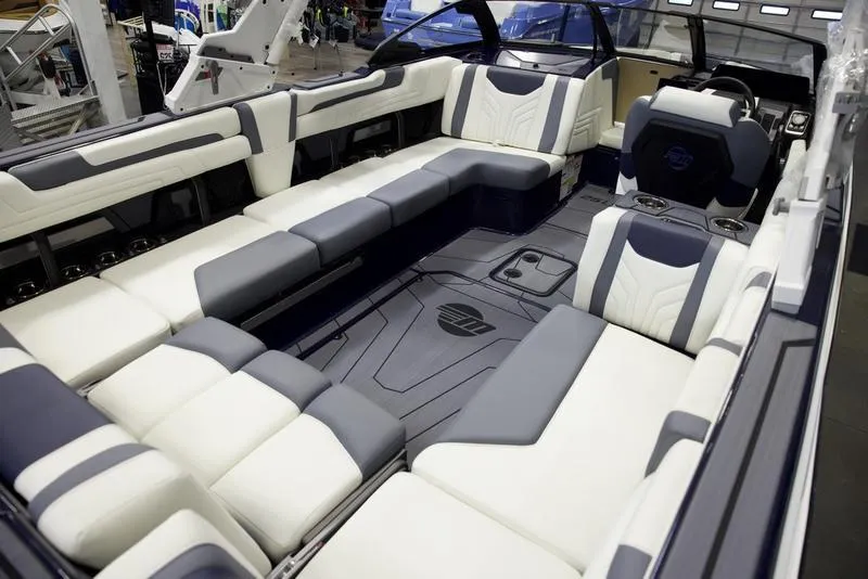 Slide: The Image of 2025 Malibu 25 LSV boat interior with luxurious seating and modern design. - 13