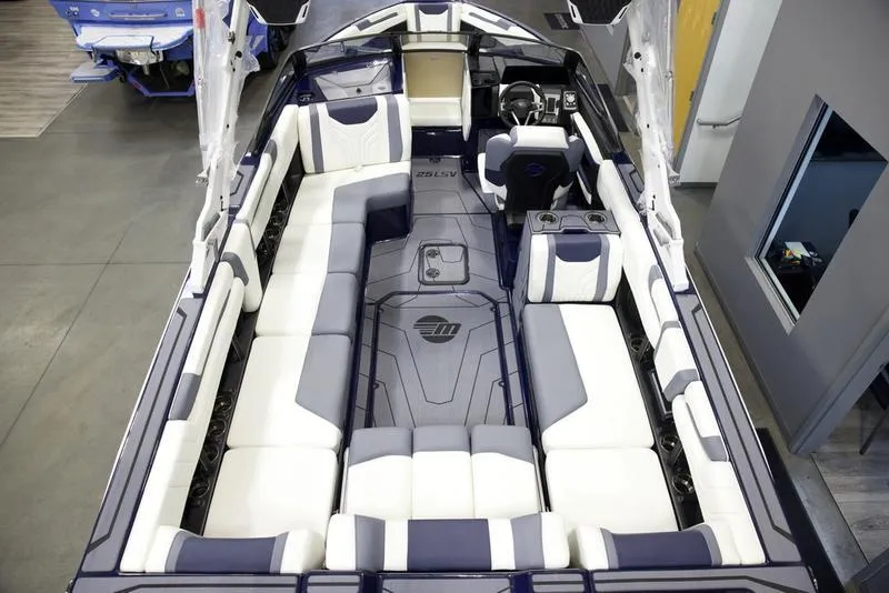 Slide: The Image of 2025 Malibu 25 LSV boat interior with spacious seating and modern design. - 15