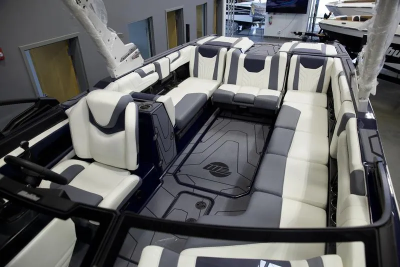 Slide: The Image of 2025 Malibu 25 LSV boat interior with luxurious seating and modern design. - 18