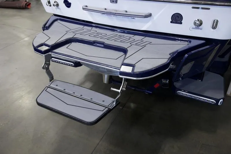 Slide: The Image of 2025 Malibu 25 LSV boat swim platform with step, featuring sleek design and durable materials. - 5