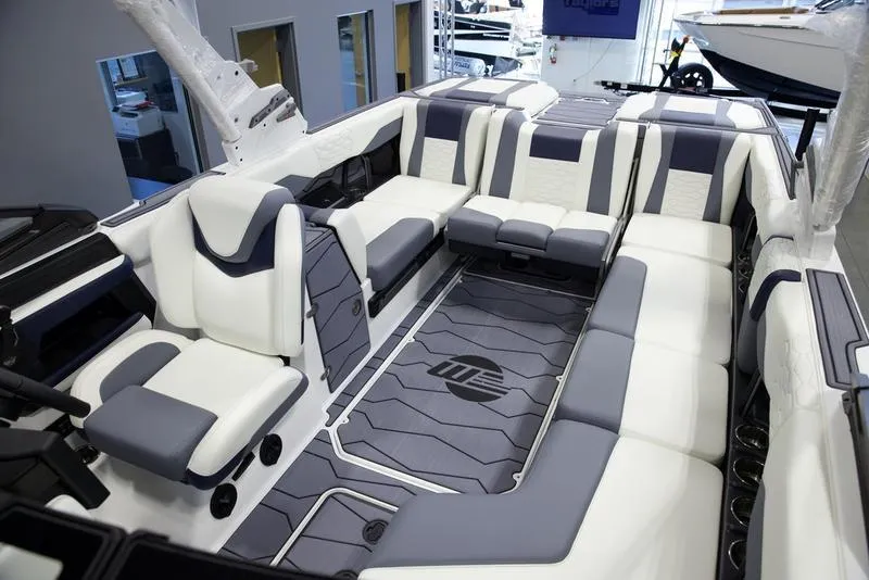 Slide: The Image of Luxurious interior of 2025 Malibu 24 MXZ boat with spacious seating and modern design. - 28