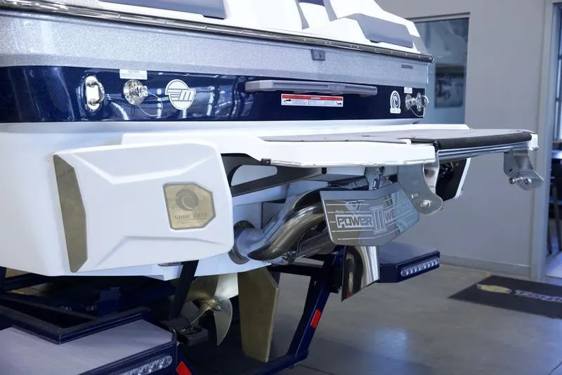 Slide: The Image of 2025 Malibu 24 MXZ boat rear view showcasing exhaust and design details. - 5