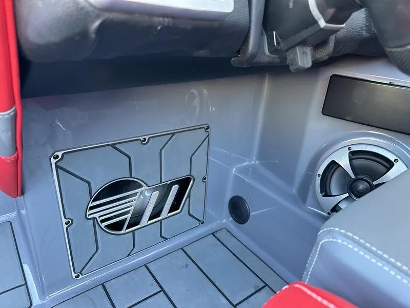 Slide: The Image of 2024 Malibu 23 MXZ interior with speaker and stylish panel design. - 13