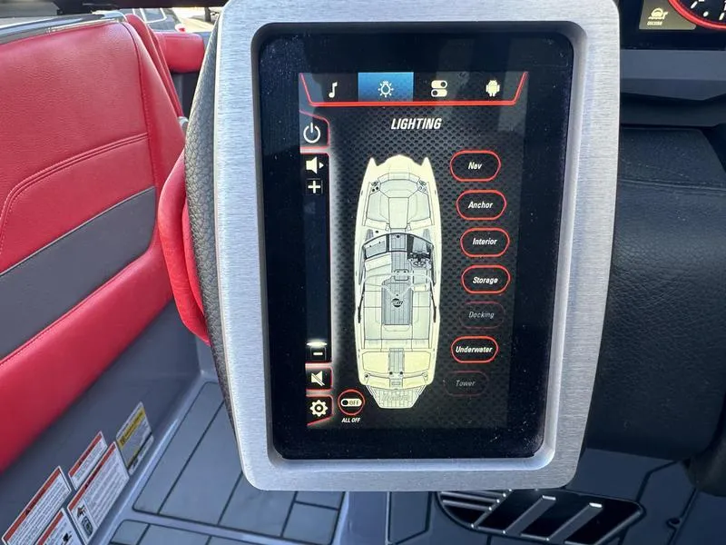 Slide: The Image of 2024 Malibu 23 MXZ boat touchscreen display with lighting controls. - 17