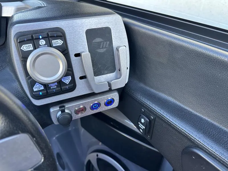 Slide: The Image of 2024 Malibu 23 MXZ dashboard controls with sleek design and modern features. - 19