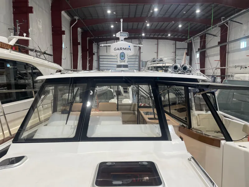 Slide: The Image of 2023 MJM 4 boat in a warehouse, featuring Garmin equipment. - 15