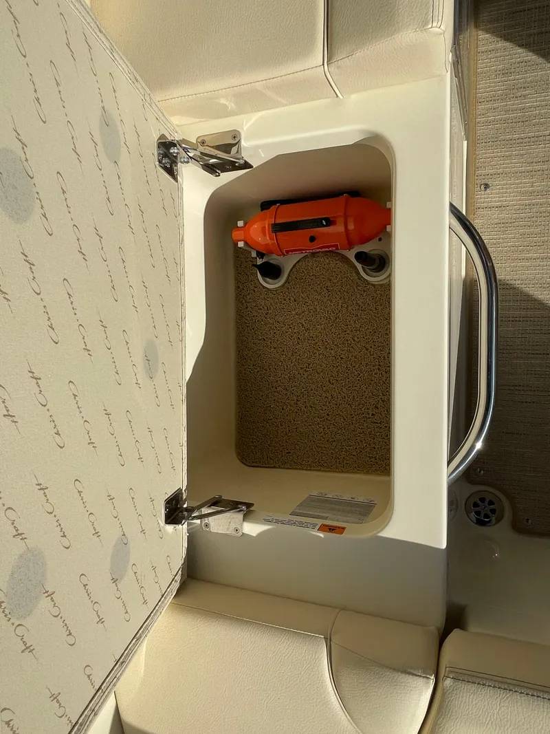 Slide: The Image of Storage compartment in 2025 Chris-Craft Launch 28GT boat with safety equipment. - 10