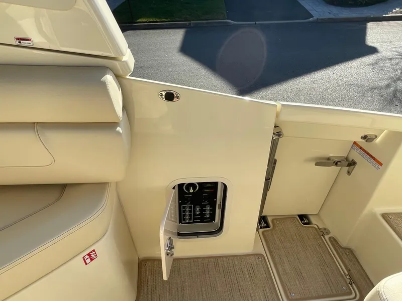 Slide: The Image of 2025 Chris-Craft Launch 28GT interior, featuring beige seating and control panel. - 15