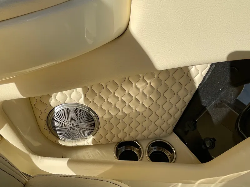Slide: The Image of Luxurious interior of 2025 Chris-Craft Launch 28GT with quilted leather and speaker detail. - 16