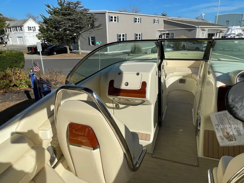 Slide: The Image of 2025 Chris-Craft Launch 28GT boat interior with beige seating and wood accents. - 17