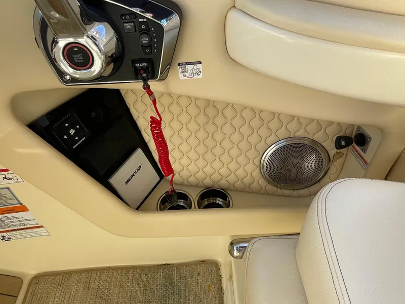 Slide: The Image of 2025 Chris-Craft Launch 28GT interior, featuring control panel, speaker, and luxurious seating. - 22