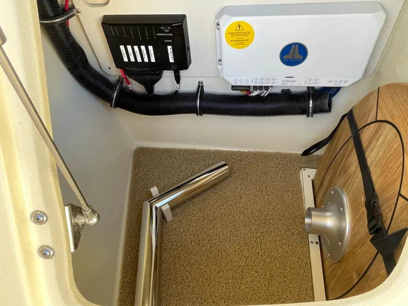 Slide: The Image of 2025 Chris-Craft Launch 28GT interior compartment with wiring and equipment. - 27