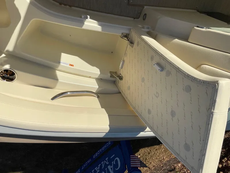 Slide: The Image of 2025 Chris-Craft Launch 28GT boat interior with open storage compartment. - 28