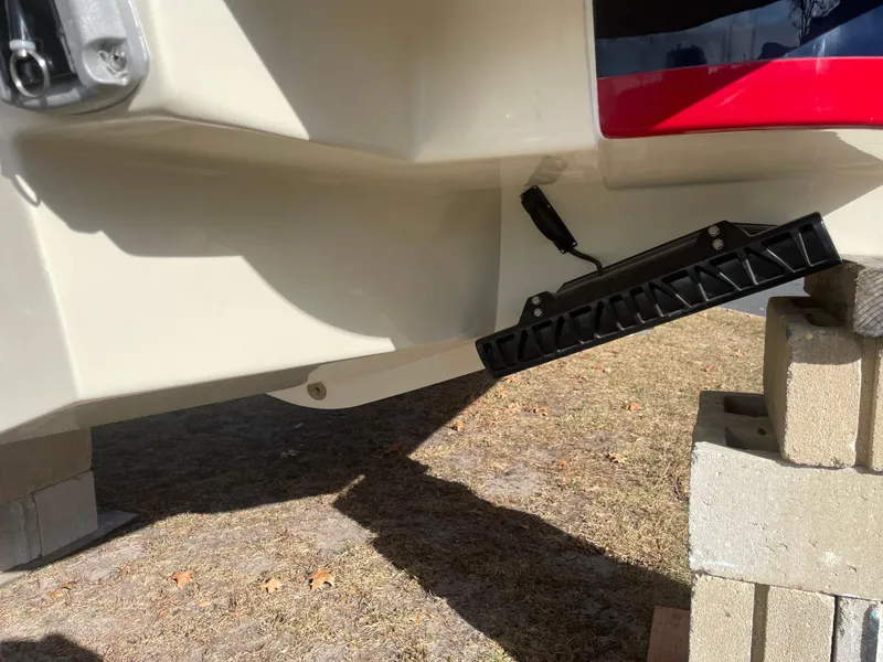 Slide: The Image of 2025 Chris-Craft Launch 28GT boat hull on blocks, showcasing rear detail. - 3