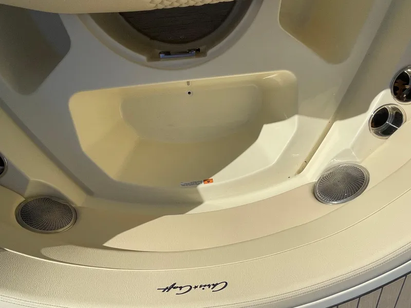 Slide: The Image of 2025 Chris-Craft Launch 28GT boat interior with speakers and logo. - 30