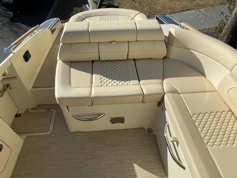 Slide: The Image of 2025 Chris-Craft Launch 28GT boat interior with beige leather seating and elegant design. - 7