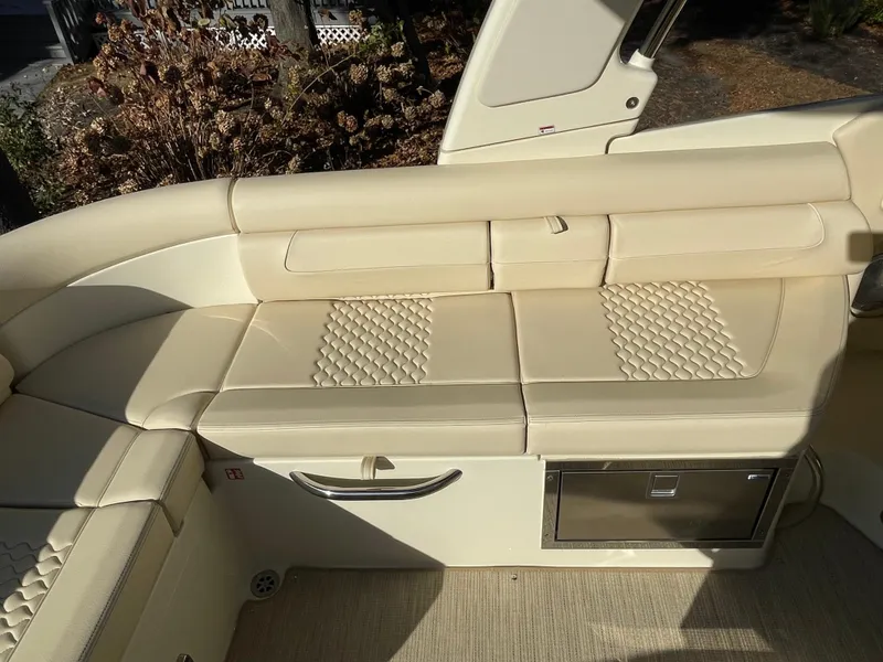 Slide: The Image of Luxurious seating on 2025 Chris-Craft Launch 28GT boat with beige upholstery. - 8