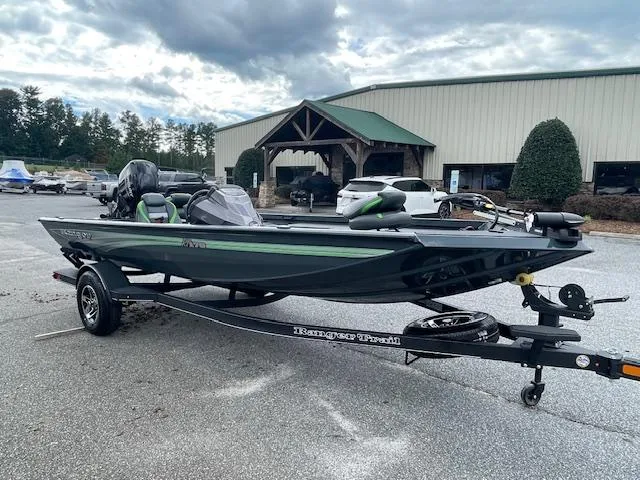 The Image of 2025 Ranger RT178 boat on trailer, parked outdoors near a building. - 0