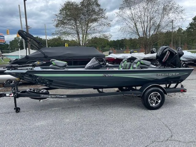 Slide: The Image of 2025 Ranger RT178 fishing boat on trailer, parked outdoors. - 4