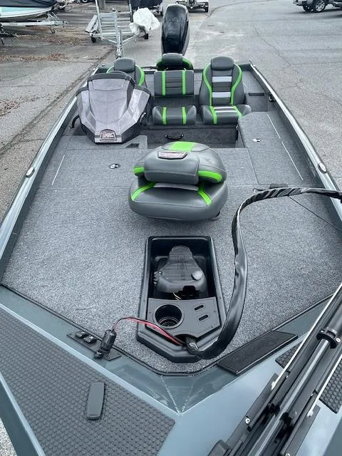 Slide: The Image of 2025 Ranger RT178 fishing boat with gray and green seating, spacious deck, and storage compartments. - 7