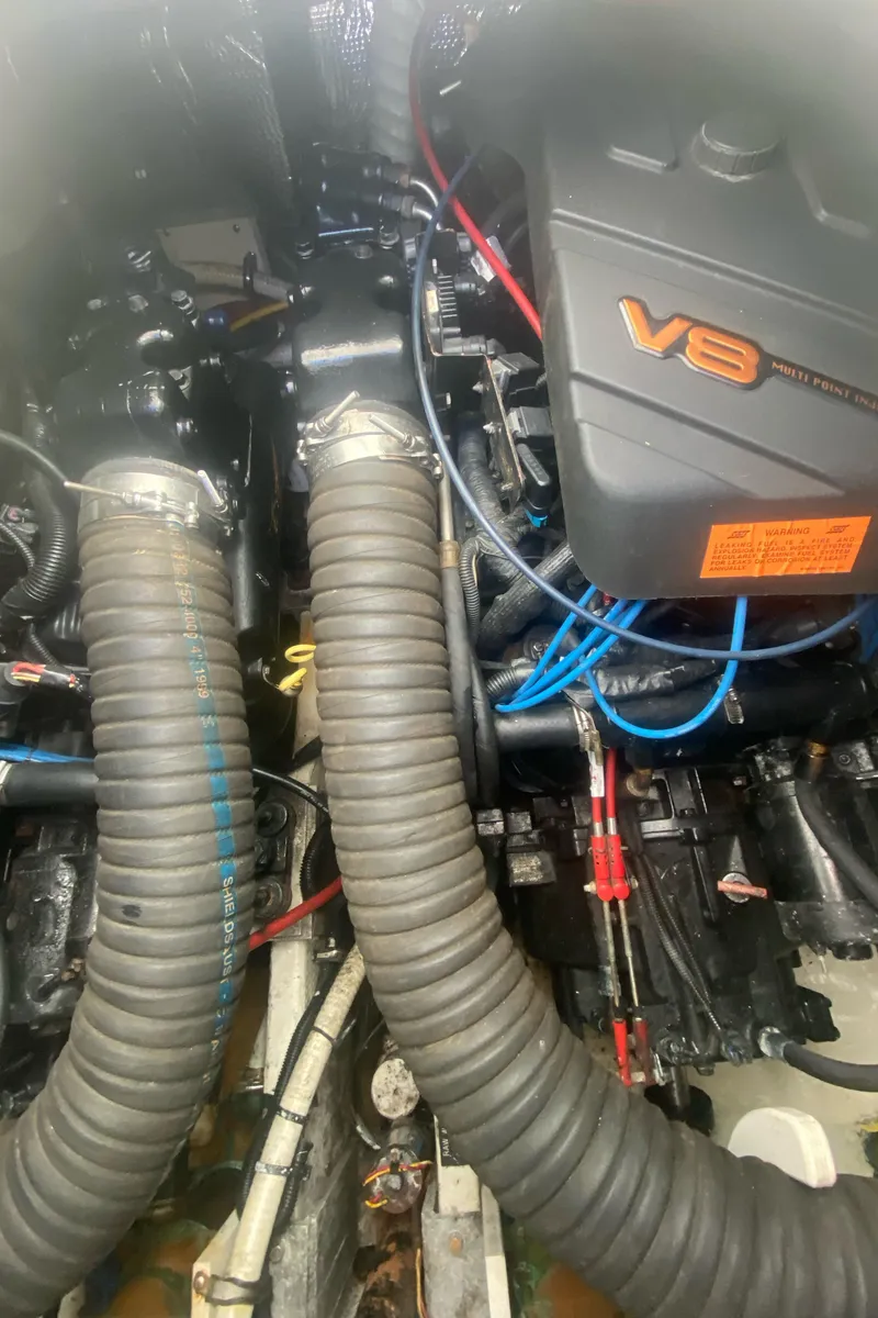 Slide: The Image of V8 engine of 2000 Rampage 30 Offshore boat with visible hoses and wiring. - 11