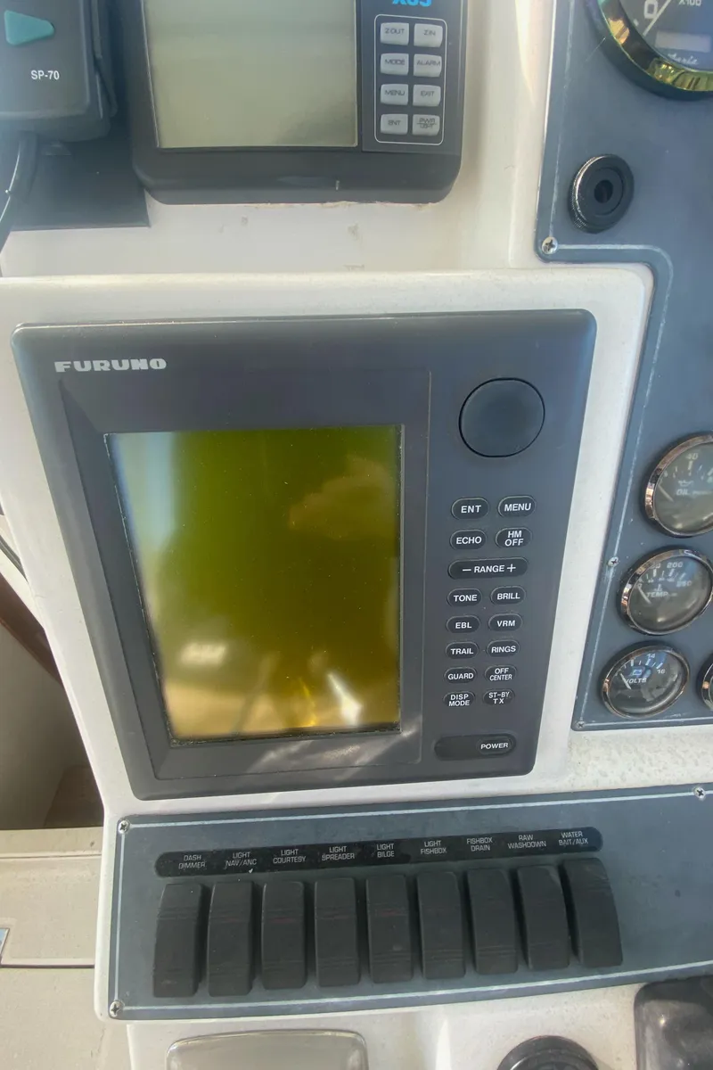 Slide: The Image of Furuno marine electronics on 2000 Rampage 30 Offshore boat dashboard. - 6