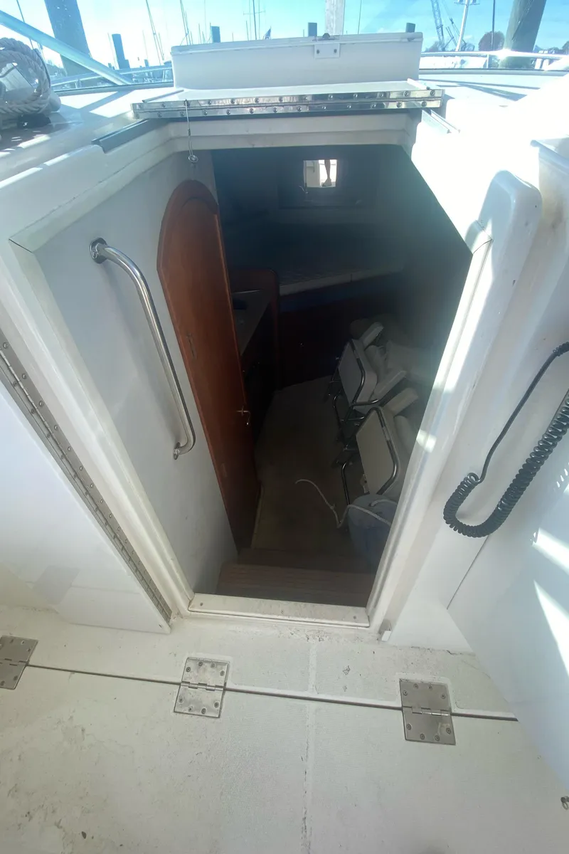 Slide: The Image of Interior view of 2000 Rampage 30 Offshore boat cabin entrance. - 8