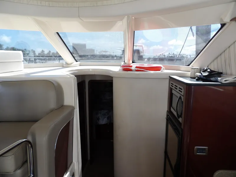 Slide: The Image of Interior of 2008 Sea Ray 44 Sedan Bridge yacht with seating and control panel. - 32