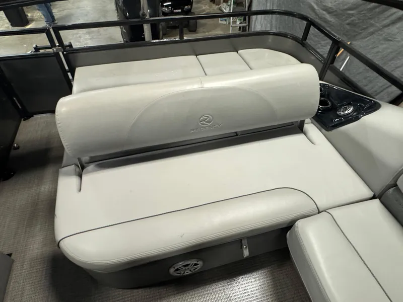 Slide: The Image of 2019 Regency 250 DL3 boat interior with gray seating and cup holders. - 16