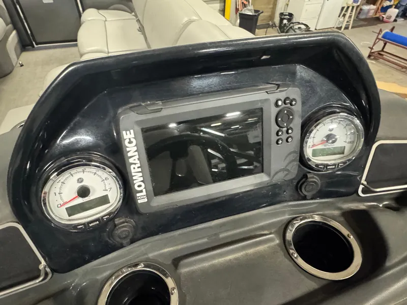 Slide: The Image of 2019 Regency 250 DL3 dashboard with Lowrance display and gauges. - 19