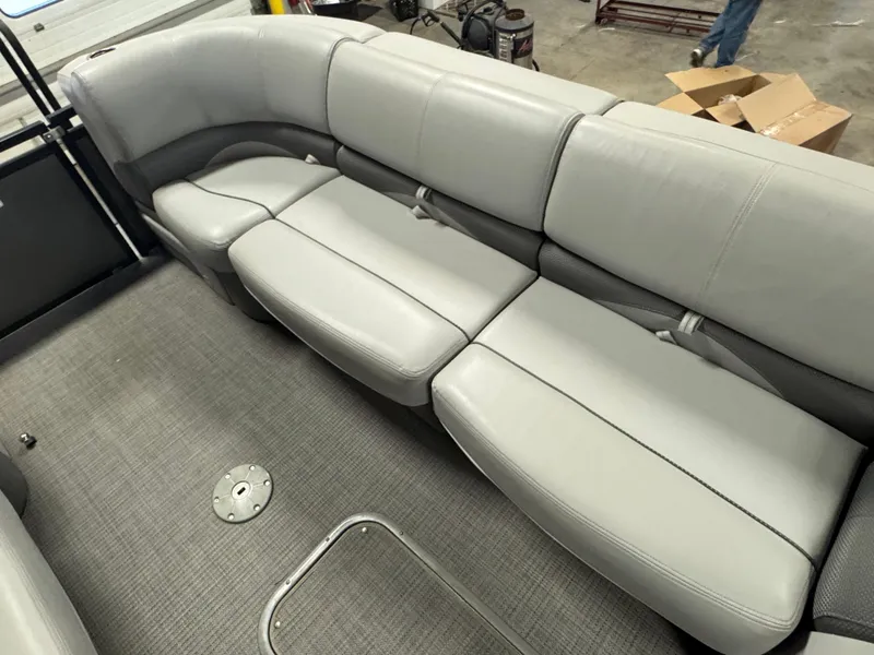 Slide: The Image of 2019 Regency 250 DL3 boat interior with gray seating and carpeted floor. - 21