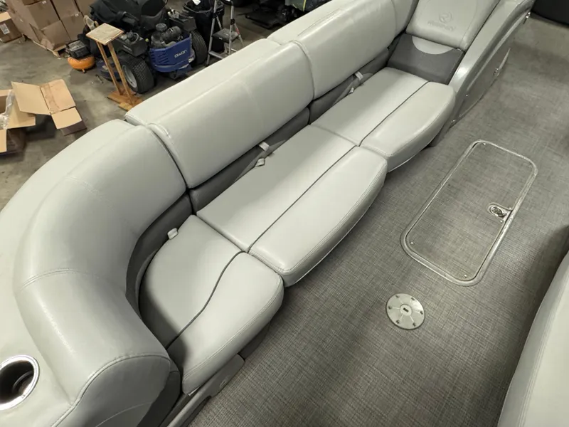 Slide: The Image of 2019 Regency 250 DL3 boat interior with gray seating and carpeted floor. - 8
