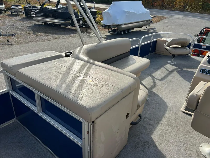 Slide: The Image of 2017 Sun Tracker Fish Barge 22 DLC pontoon boat interior with seating and storage. - 3