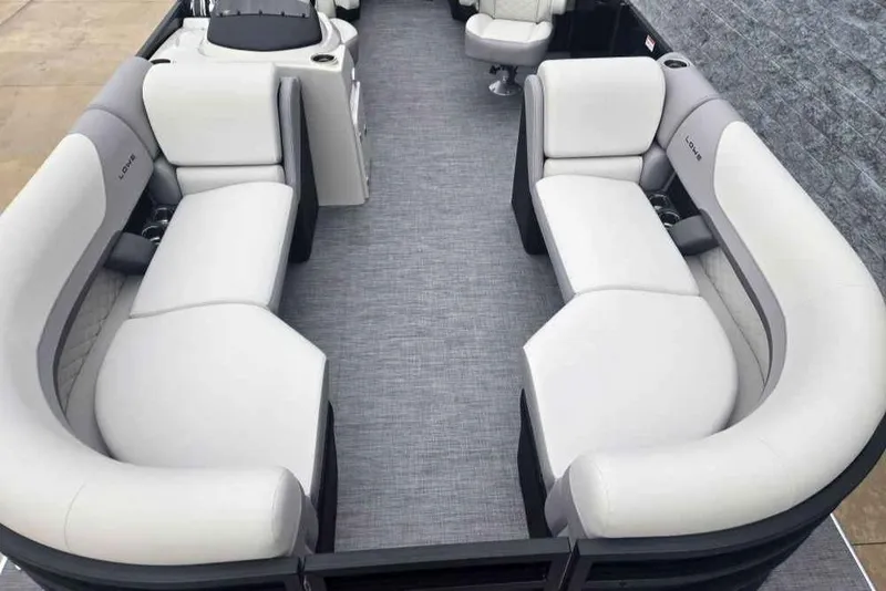 Slide: The Image of 2025 Lowe SS 230 WV pontoon boat interior with plush seating and modern design. - 3