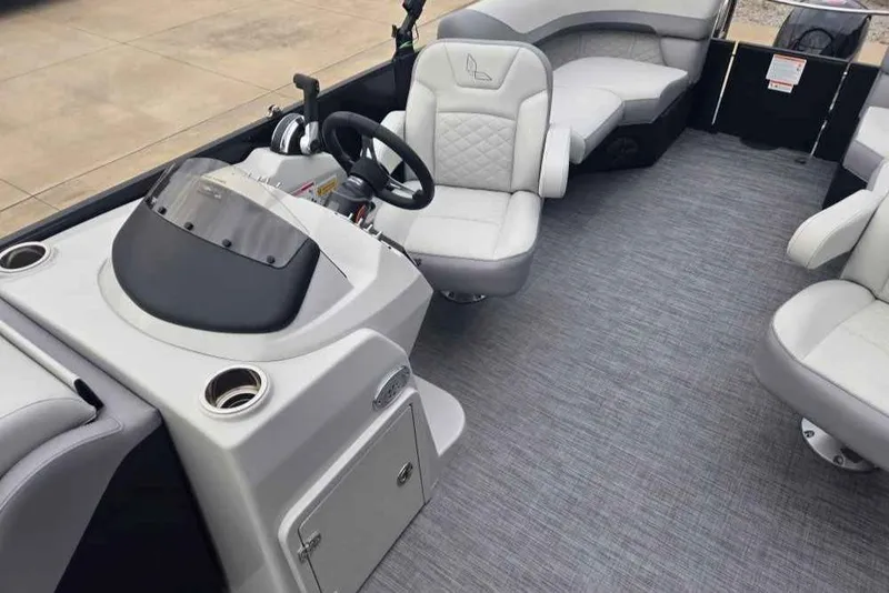 Slide: The Image of 2025 Lowe SS 230 WV boat interior with modern seating and steering console. - 5