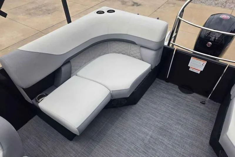 Slide: The Image of 2025 Lowe SS 230 WV boat interior with gray seating and carpet. - 8