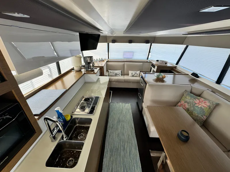 Slide: The Image of Luxurious interior of 2017 Fountaine Pajot MY 37 yacht with modern kitchen and seating area. - 10