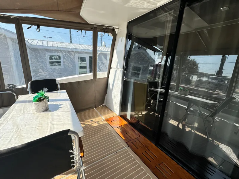 Slide: The Image of 2017 Fountaine Pajot MY 37 yacht interior with dining area and glass doors. - 20