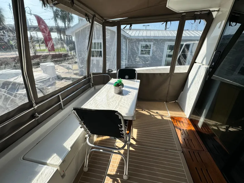 Slide: The Image of 2017 Fountaine Pajot MY 37 yacht interior with dining area and panoramic windows. - 21