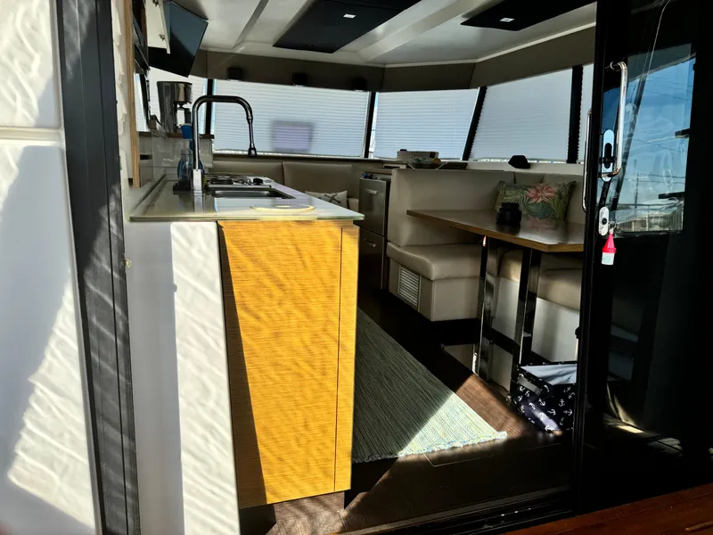 Slide: The Image of Interior of 2017 Fountaine Pajot MY 37 yacht with modern kitchen and seating area. - 9
