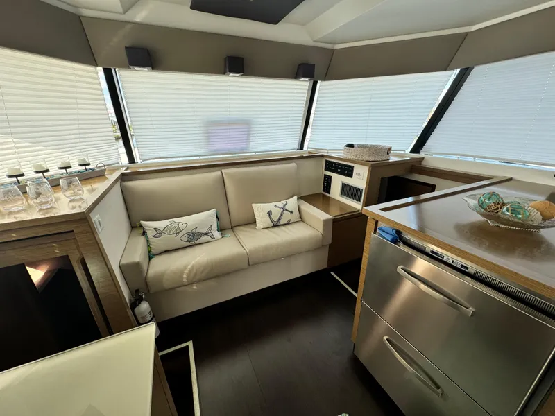 Slide: The Image of Luxurious interior of 2017 Fountaine Pajot MY 37 yacht with modern kitchen and seating area. - 12