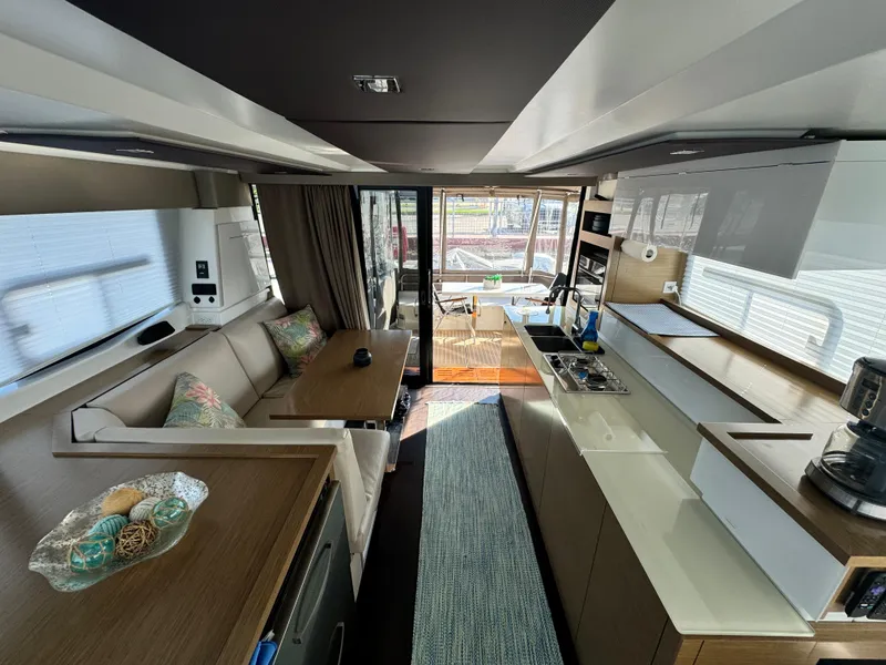 Slide: The Image of Luxurious interior of 2017 Fountaine Pajot MY 37 yacht with modern kitchen and seating area. - 14
