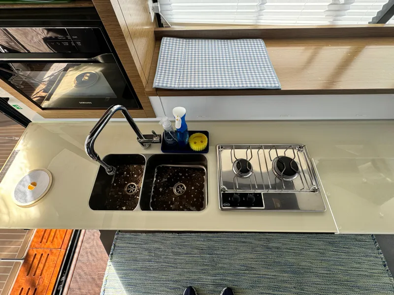 Slide: The Image of Modern kitchen in 2017 Fountaine Pajot MY 37 yacht with dual sink and stove. - 15