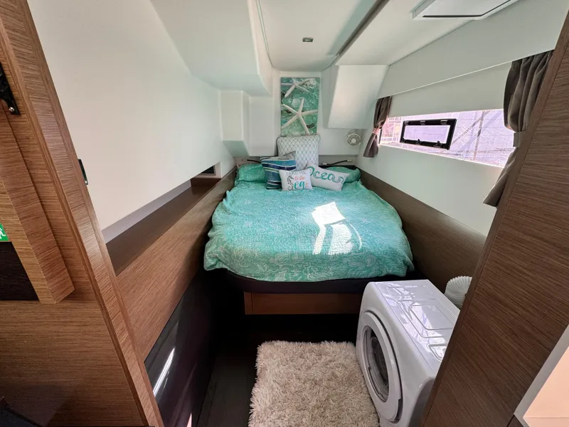 Slide: The Image of Cozy bedroom in 2017 Fountaine Pajot MY 37 yacht with bed and washing machine. - 25