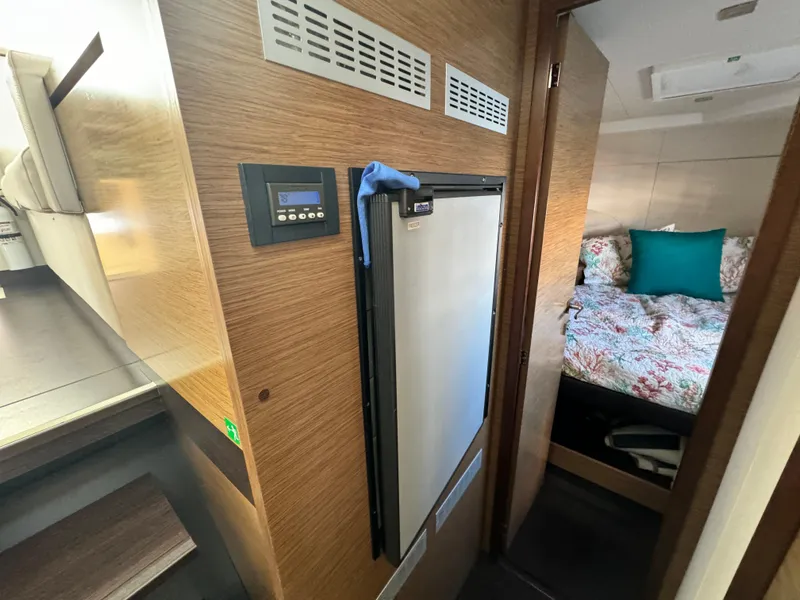 Slide: The Image of 2017 Fountaine Pajot MY 37 interior with fridge and cozy bedroom. - 28