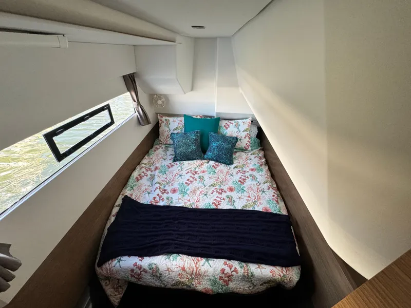 Slide: The Image of Cozy bedroom in 2017 Fountaine Pajot MY 37 yacht with floral bedding and window view. - 30