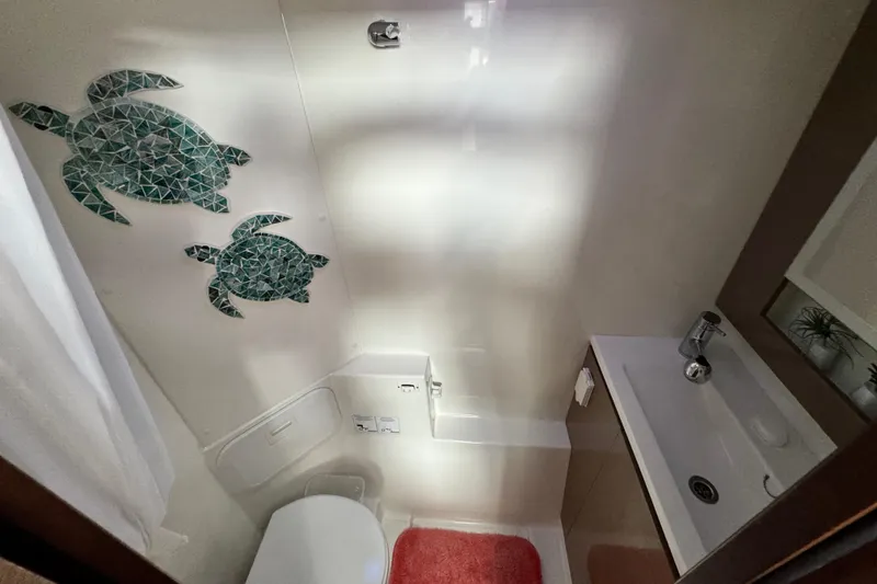Slide: The Image of Bathroom in 2017 Fountaine Pajot MY 37 yacht with turtle wall art. - 31