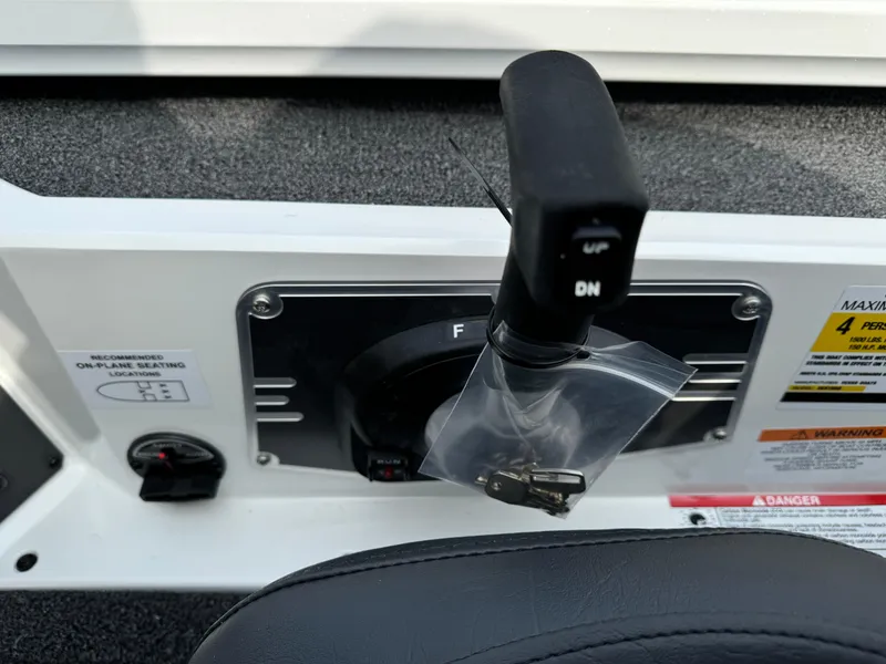 Slide: The Image of Control panel of 2025 Vexus AVX1980 boat with throttle lever and safety instructions. - 11